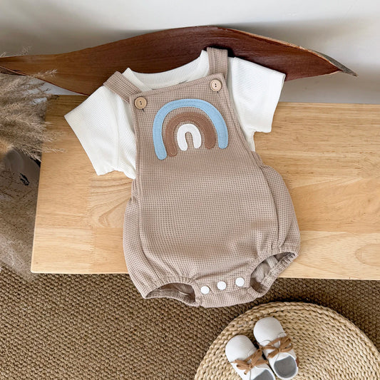 Children's summer outfit - suspender jumpsuit with striped t-shirt and rainbow patch.