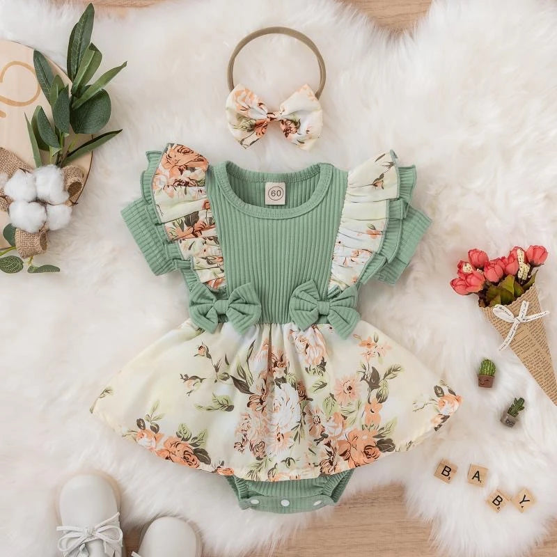Girls' green jumpsuit dress with front bow - floral and striped print for summer.